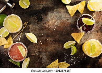 Variety Of Margarita Cocktails With Salted Rim And Lime On Dark Background Overhead Shot With Copy Space