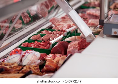 Variety Of Meat Displayed In Butcher's Shop