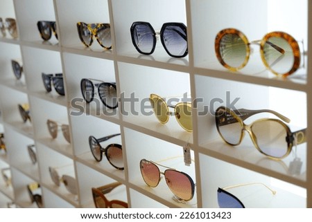 Variety of modern trendy sunglasses on showcase