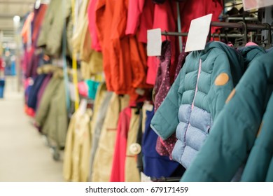 Variety Of Modern Winter Jackets On Hangers In Outdoor Sports Store