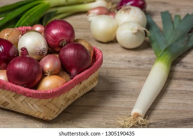 Variety of onions. In the frame, onions, leeks, shallots, white, sweet red, yellow onions, green onions.  - Powered by Shutterstock