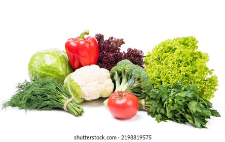 Variety Of Organic Vegetables Cabbages, Bell Pepper And Leafy Greens Isolated On White