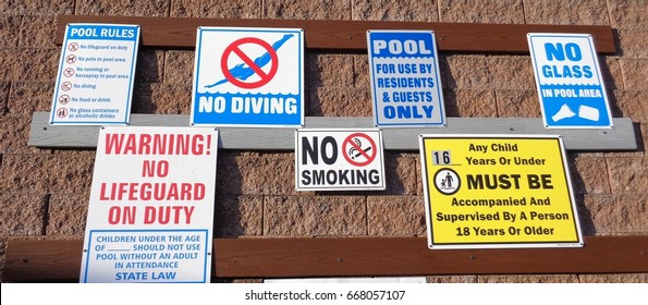 A Variety Of Pool Safety Signs In English