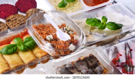 A Variety Of Prepackaged Food Products In Plastic Boxes.