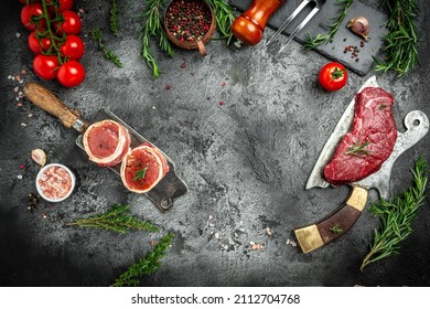 Variety Of Raw Black Angus Prime Meat Steaks Beef Rump Steak, Tenderloin Fillet Mignon For Grilling On Old Meat Cleaver On Dark Background. Banner, Menu Recipe Top View.