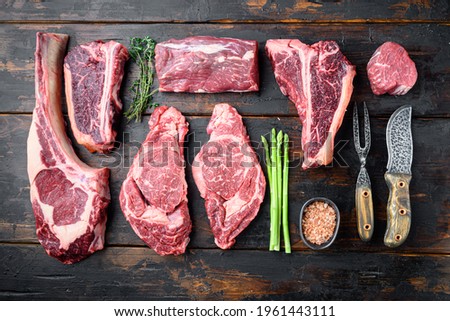 Similar – Dry aged raw tomahawk beef steak isolated on white background