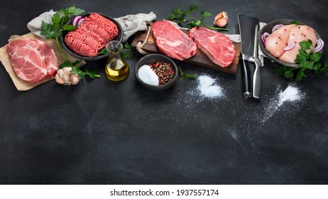 Variety of raw meat  with seasoning  on dark background. Top view with copy space - Powered by Shutterstock