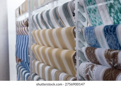 Variety of Rolled Up Patterned Fabric Samples for Interior Design Choice