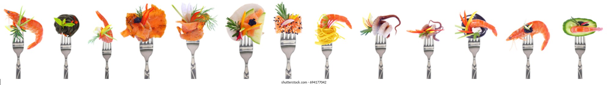 Variety of seafood appetizers on forks - white background - Powered by Shutterstock