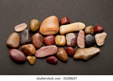 Variety Of Smooth Pebbles Of Different Colors Is A Metaphor For Ethnic Diversity; Add Your Own Letters To Spell 