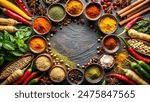 a variety of spices and herbs arranged on a dark, circular stone surface. Small bowls contain ingredients