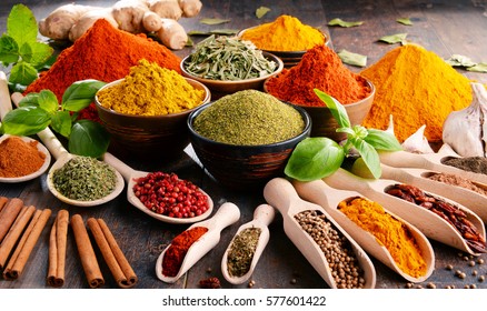 Variety of spices and herbs on kitchen table. - Powered by Shutterstock