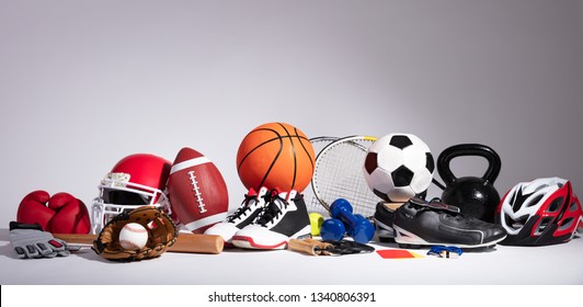 Variety Of Sport Balls And Equipment In Front Of Gray Surface - Powered by Shutterstock