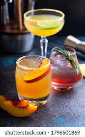 Variety Of Summer Cocktails With Aromatic Bitters On Dark Background