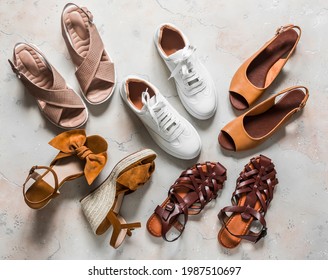 Variety of summer women's shoes - sneakers, sandals, roman sandals, slippers on a light background, top view