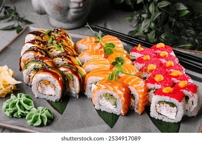 Variety of sushi rolls are presented on a plate, showcasing the colorful and fresh ingredients