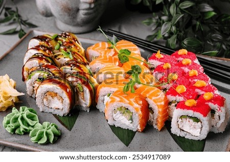 Similar – Image, Stock Photo Delicious sushi rolls on board with chopsticks