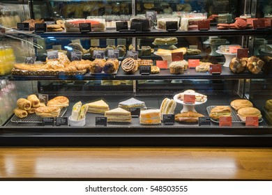 Variety Of Tasty Pastry In Glass Display 