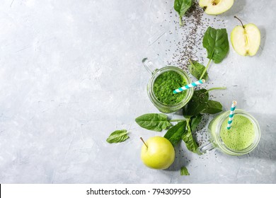 Variety of three color green spinach kale apple yogurt smoothie in mason jars with retro cocktail tubes and ingredients above over gray texture background. Healthy vegan detox eating. Top view, space - Powered by Shutterstock