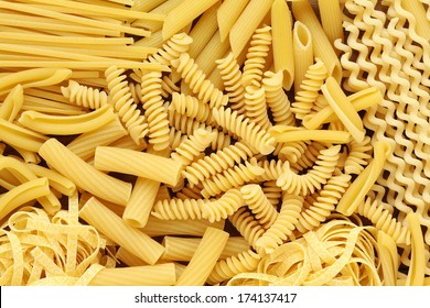 Variety of types and shapes of dry Italian pasta - Shutterstock ID 174137417