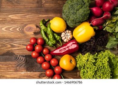 
Variety of vegetables on wooden background. 