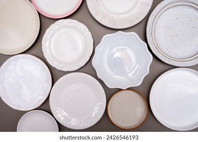 Variety of white ceramic or porcelain trendy plates flat lay copy space - Powered by Shutterstock