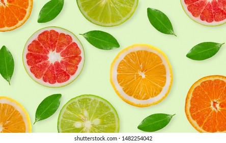 Variety Of Whole And Sliced Citrus Fruits , Lemon, Lime,grapefruit And Orange