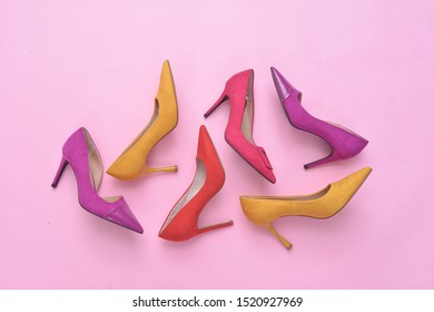 Variety of women's footwear with thin high heels, stiletto shoes on pink background


 - Powered by Shutterstock