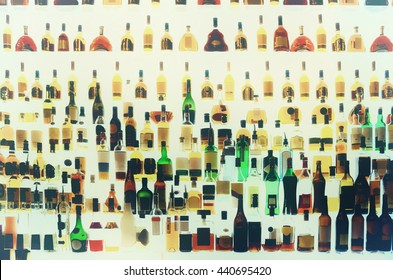 Various alcohol bottles in a bar, back light, all logos removed, toned