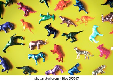 Various Animal Toy Figures In A Colorful Background