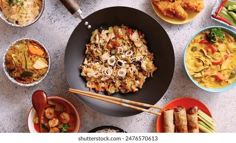 Various Asian dishes displayed in bowls, showcasing a vibrant and delicious assortment of traditional flavors. Perfect for food lovers seeking an authentic and gourmet culinary experience. - Powered by Shutterstock