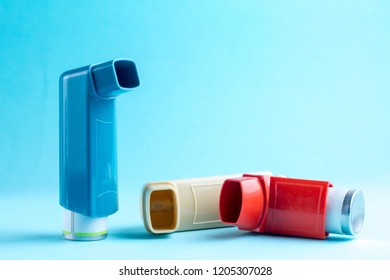 Various Asthma Inhalers On Blue Background Stock Photo 1205307028 ...