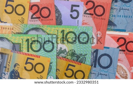 various Australian dollar notes as background. Color AUD banknotes. Finance and saving