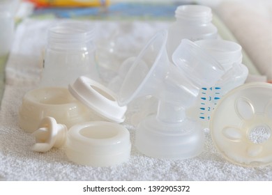 Various baby newborn mixed feeding equipment drying after sterilisation: bottles, breast pump