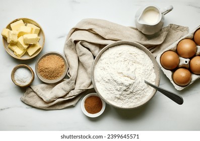 various baking ingredients on light grey painted kitchen table background, top view - Powered by Shutterstock