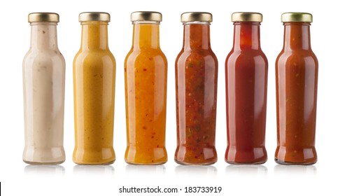 the various barbecue sauces in glass bottles