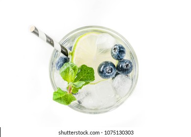 Various berry lemonade or mojito cocktails, fresh iced lemon lime raspberry blueberry infused water, summer healthy detox drinks isolated on white top view - Powered by Shutterstock