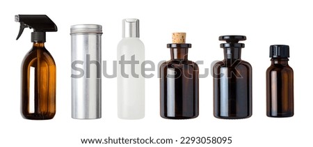 various blank bottles and containers - spray bottle, aluminium tin with screw lid, amber glass bottles and a white one, isolated packaging design elements, front view