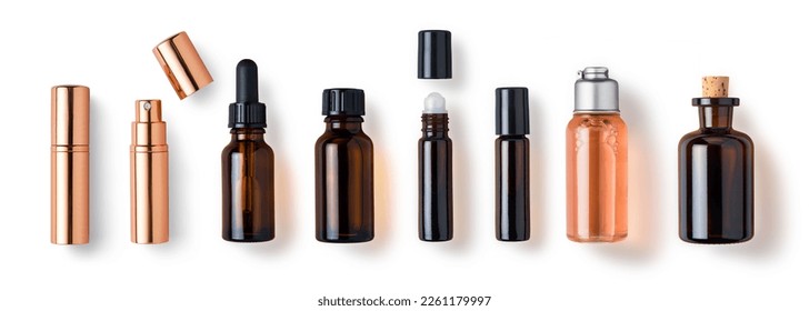 various bottles, roller bottles, spray bottles made of glass and metal for cosmetics, natural medicine , essential oils or other liquids isolated over a white background, top view	