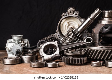 Various car parts and accessories, on black  background - Shutterstock ID 1402328183
