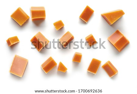 various caramel pieces isolated on white background, top view