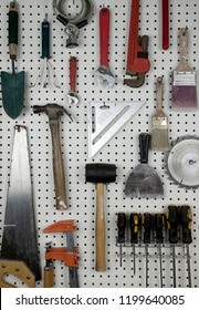 Various Carpentry Tools In A Garage On Pegboard