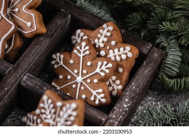 Various christmas gingerbread stars on wooden background