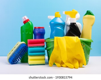 Various cleaning supplies, detergents and cleaning products on blue background. - Powered by Shutterstock