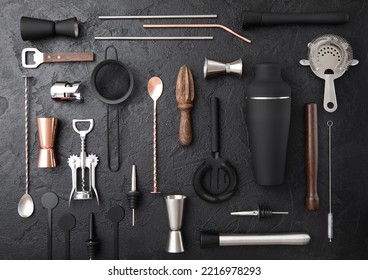 Various Cocktail Bar Utensils Set. Strainer,shaker,jigger,straw,juicer,muddler,wine Opener On Black Stone Background.Top View.