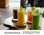 Various of cold drinks on the table. Beverage menu, summer drink. Juice, peach iced tea and cold coffee.