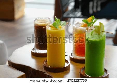 Various of cold drinks on the table. Beverage menu, summer drink. Juice, peach iced tea and cold coffee.