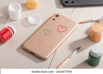 Various Color Hearts Painted On Beige Phone Case. Handpainted Art, Custom Design, Child's DIY Project.