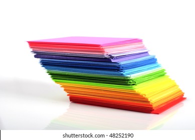 Various Color Paper Stack Like A Rainbow Isolated On White