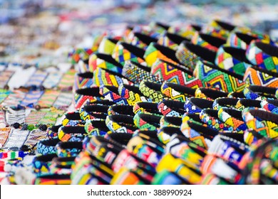 Various Colorful Bracelets On Sale At A Street Market Vendor In Cape Town, South Africa